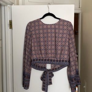 Bell sleeve crop top with a tie string back